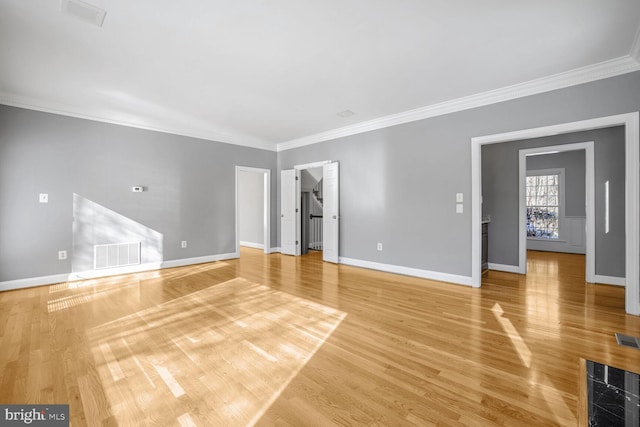 unfurnished room with hardwood / wood-style flooring and crown molding