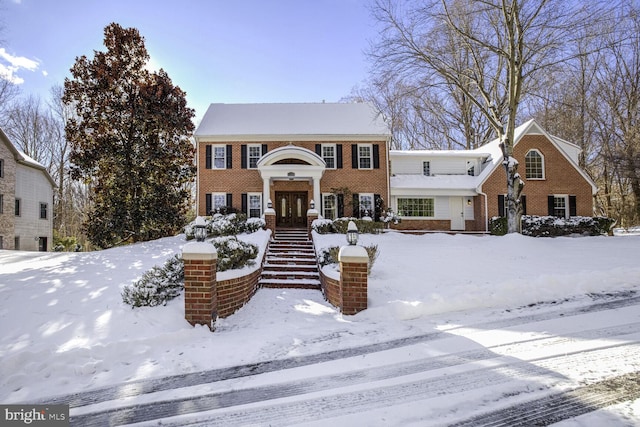 view of front of property with french doors and brick siding