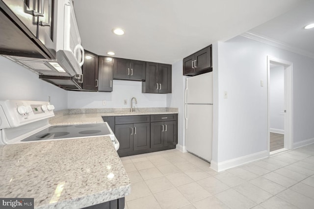 kitchen with white fridge, ornamental molding, range, dark brown cabinets, and light stone countertops