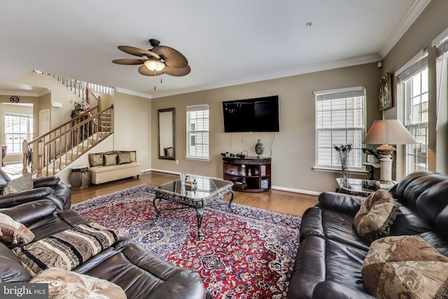 living room with crown molding, hardwood / wood-style floors, and ceiling fan