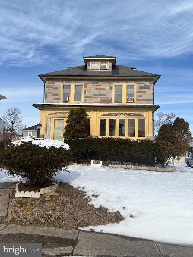 traditional style home with stone siding