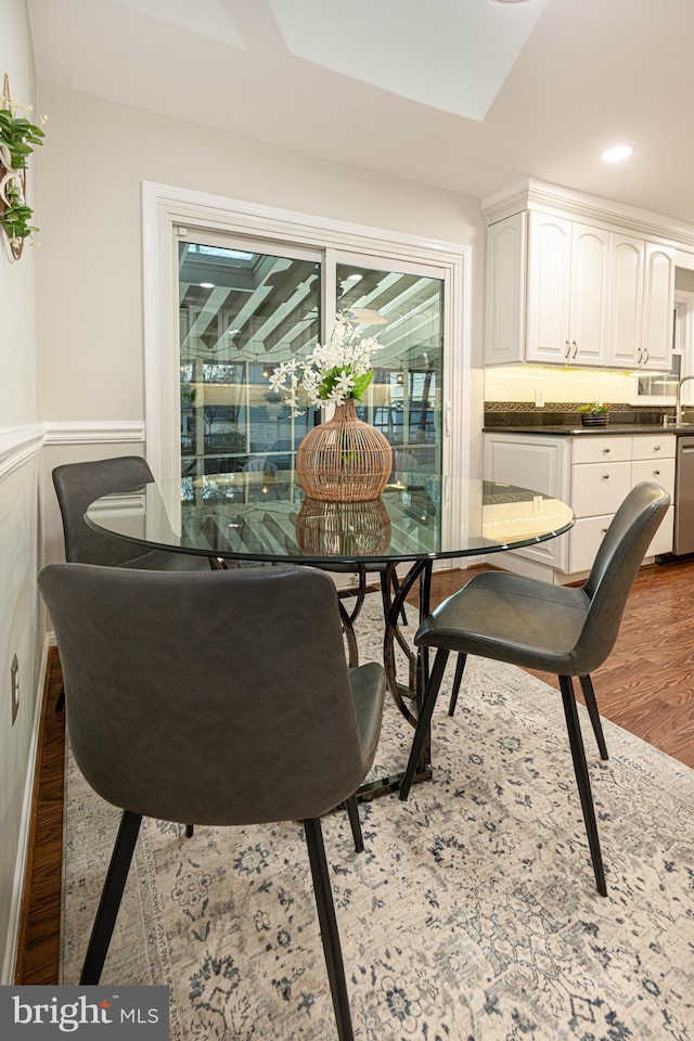 dining room with dark hardwood / wood-style flooring