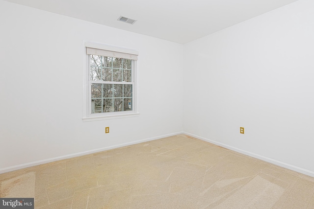 spare room featuring carpet flooring