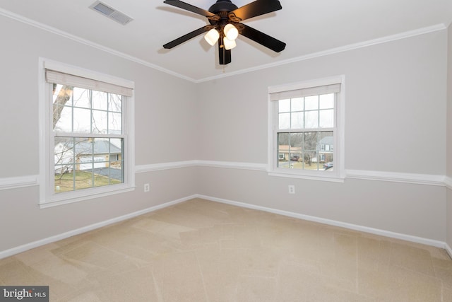 unfurnished room with ceiling fan, crown molding, and carpet floors