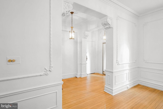 interior space featuring hardwood / wood-style flooring and ornamental molding