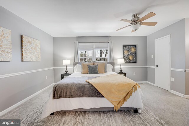 bedroom with ceiling fan and carpet flooring