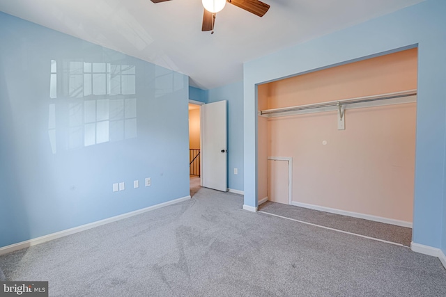 unfurnished bedroom with carpet, ceiling fan, and a closet