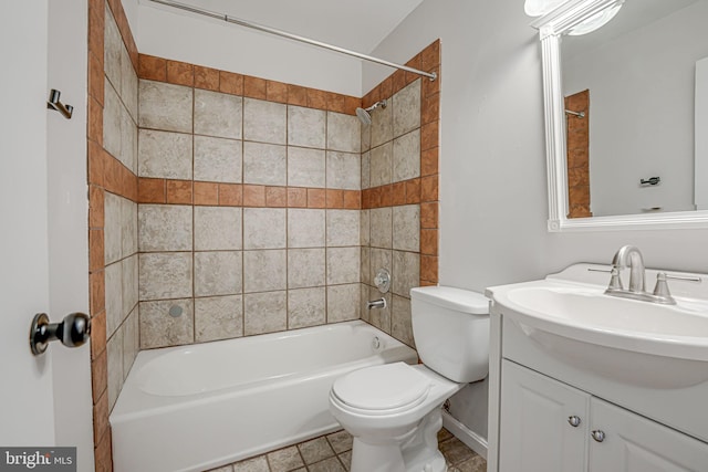 full bathroom with tiled shower / bath combo, vanity, and toilet