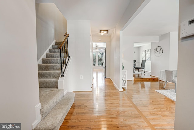 entryway featuring hardwood / wood-style floors and ceiling fan