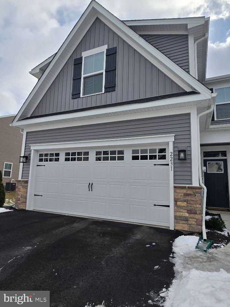 view of property exterior featuring a garage