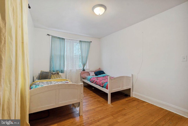 bedroom with hardwood / wood-style flooring