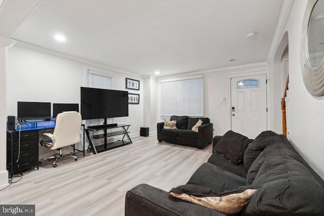 living room with light hardwood / wood-style floors and ornamental molding