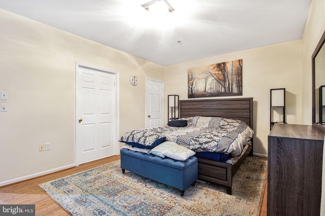 bedroom with hardwood / wood-style floors