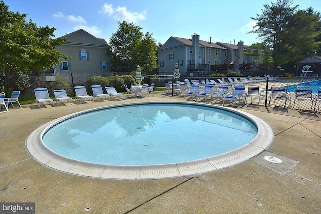 view of swimming pool featuring a patio