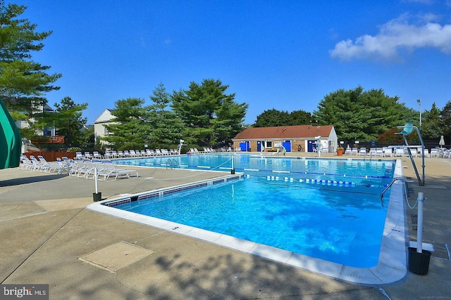 view of swimming pool with a patio area