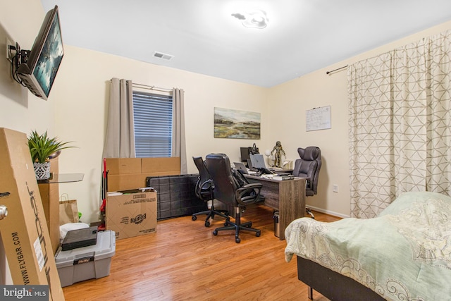 office space with hardwood / wood-style flooring