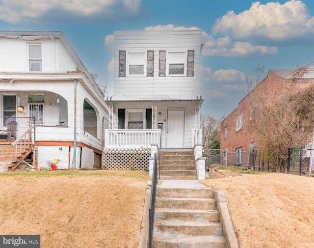 view of front of home with a front lawn and covered porch