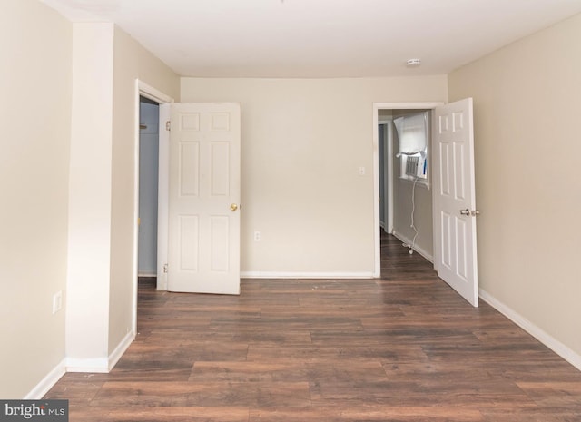 spare room featuring dark hardwood / wood-style floors