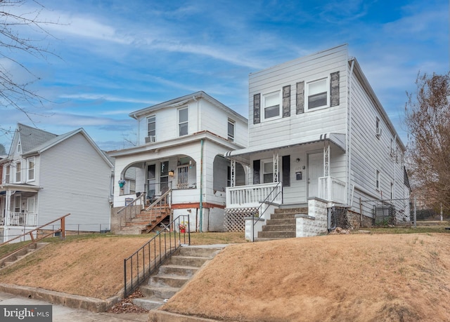 view of front of home with a porch and a front yard