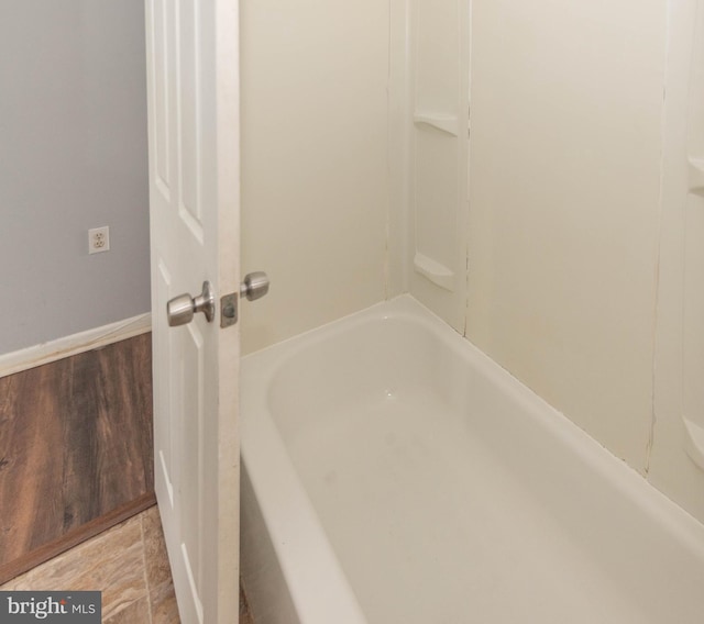 bathroom with a washtub