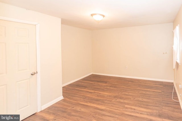 empty room featuring dark hardwood / wood-style floors