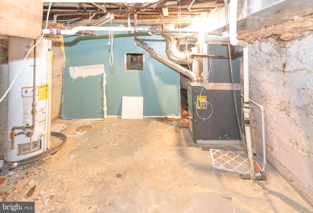 utility room featuring water heater