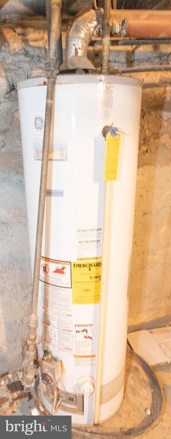 utility room with water heater