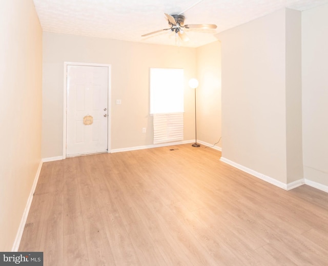 unfurnished room with ceiling fan and light hardwood / wood-style floors