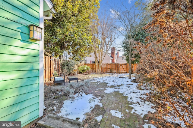 view of yard covered in snow