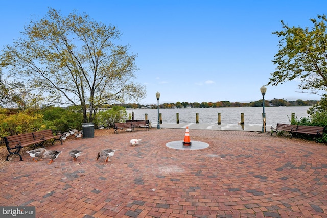 view of patio with a water view