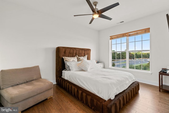 bedroom featuring ceiling fan and dark hardwood / wood-style floors