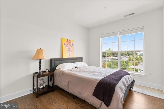 bedroom featuring dark wood-type flooring