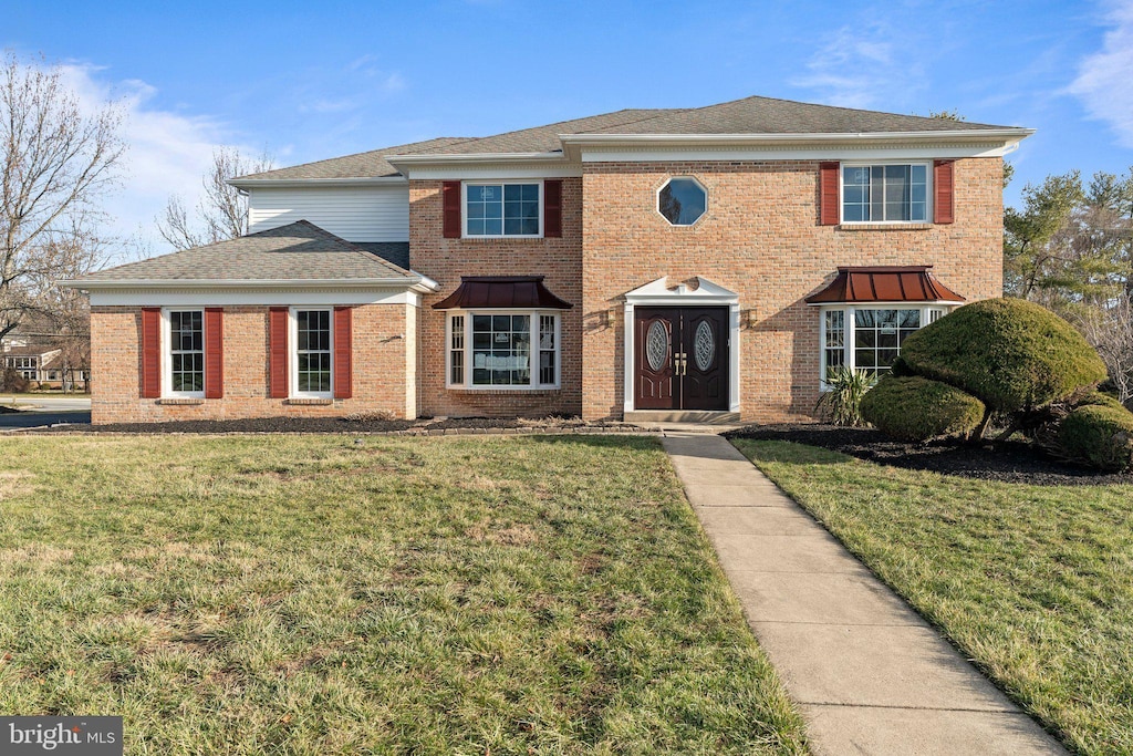 view of front of home with a front lawn