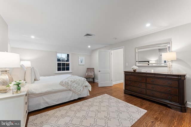 bedroom with hardwood / wood-style floors