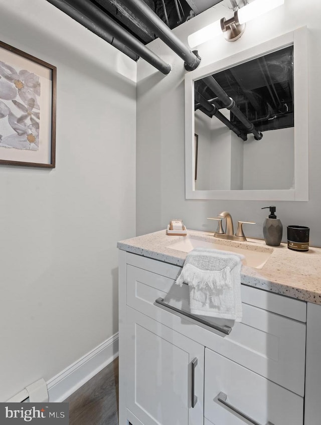 bathroom featuring vanity and wood-type flooring