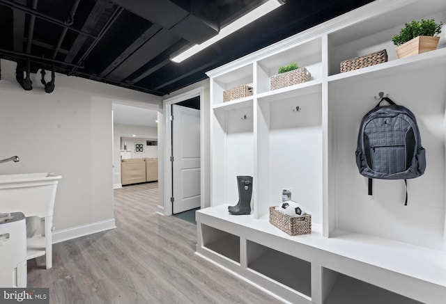 mudroom with hardwood / wood-style flooring