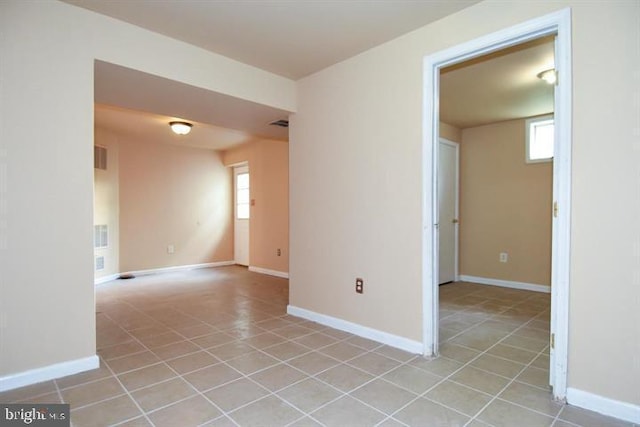 empty room featuring light tile patterned floors