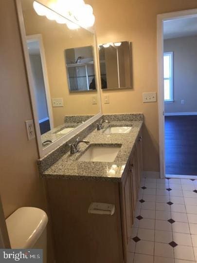 bathroom with vanity and toilet