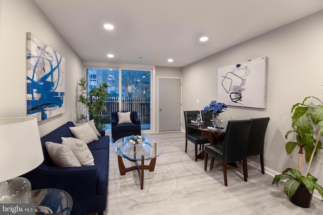 living room with light hardwood / wood-style flooring