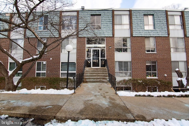 view of snow covered property