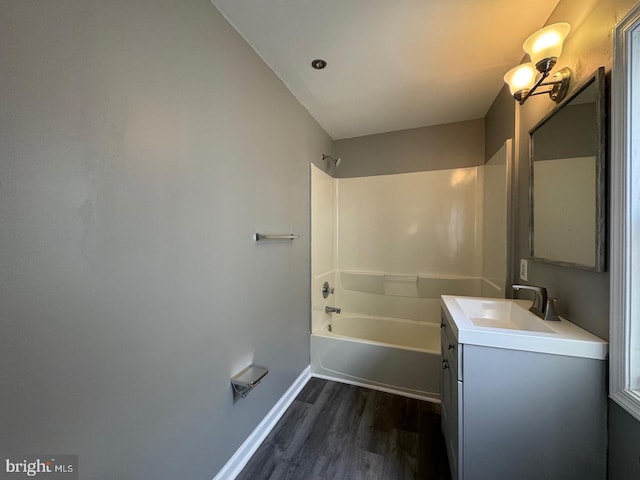 bathroom with shower / bath combination, vanity, and wood-type flooring