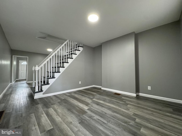 interior space with dark hardwood / wood-style floors