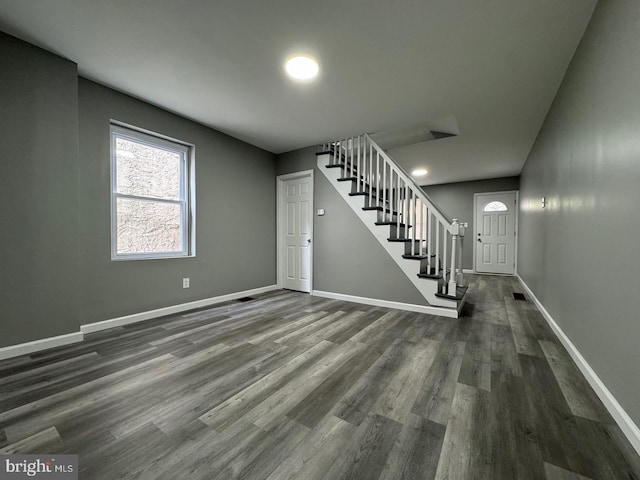 entryway featuring dark wood-type flooring