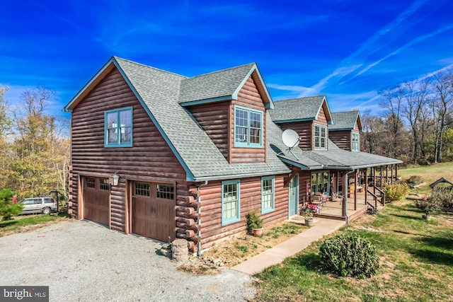 view of home's exterior with a porch and a garage