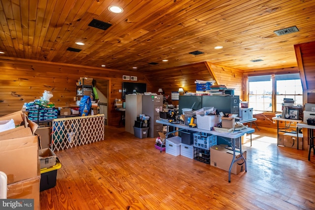 misc room with wood walls, wood ceiling, and light hardwood / wood-style floors