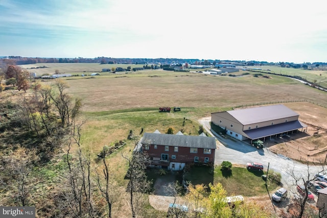 birds eye view of property with a rural view