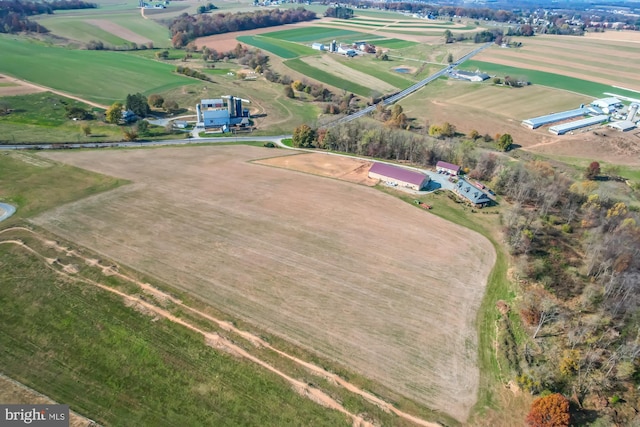 birds eye view of property with a rural view