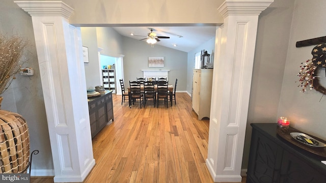 interior space featuring vaulted ceiling and light wood-type flooring