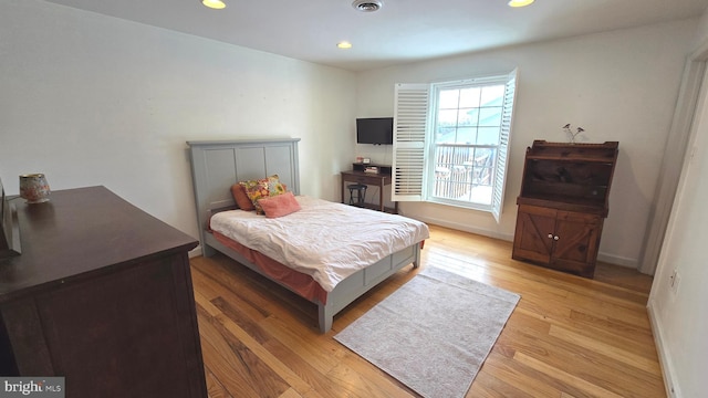 bedroom featuring light hardwood / wood-style floors