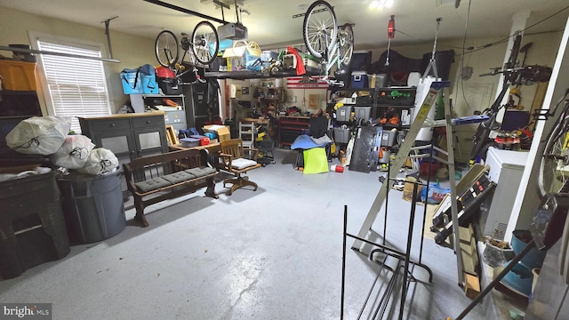 garage featuring a workshop area and a garage door opener